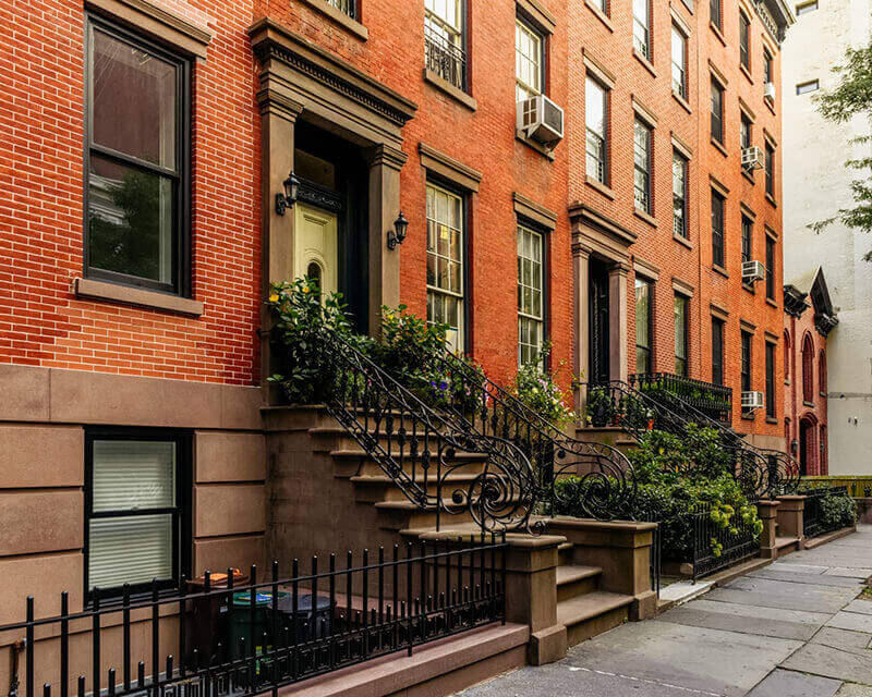 Outside of apartment building with units available to rent or own.