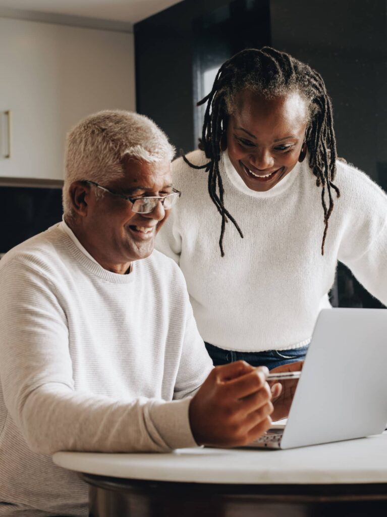 Couple researching refinance mortgage rates. 