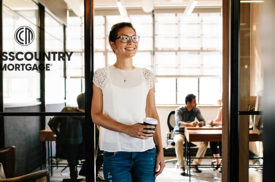 CrossCountry Mortgage branch manager poses outside of mortgage lending office.