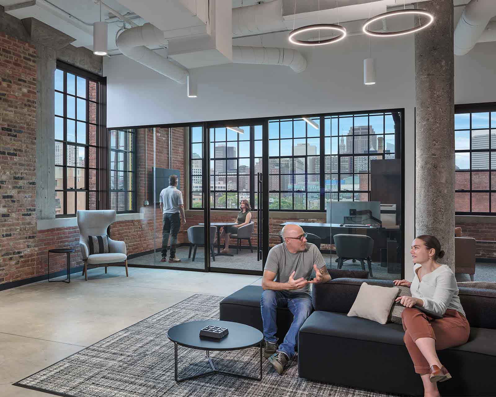 Employees meet inside mortgage lender CrossCountry Mortgage HQ located in Cleveland, OH.