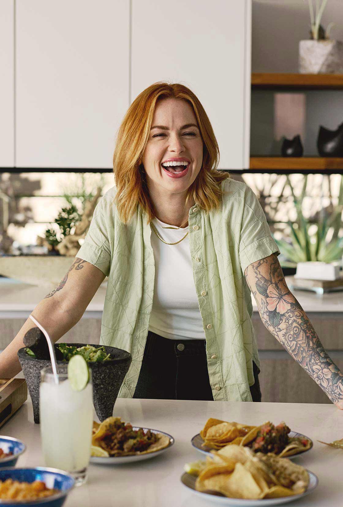 Friends enjoying dinner in an updated kitchen after completing home improvements with the help of CCM Equity Express.