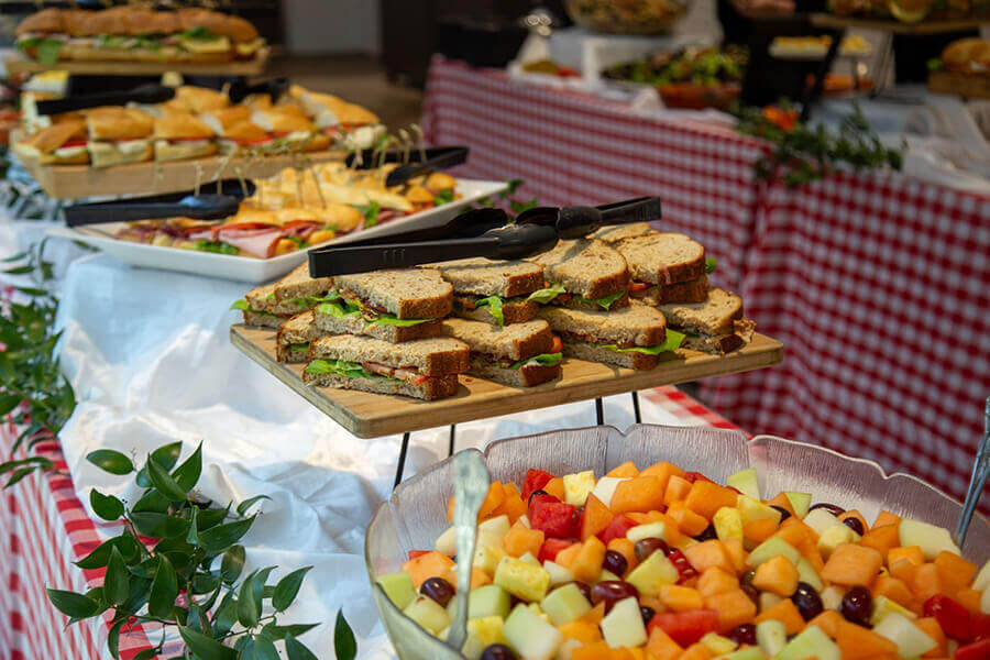 Table set up with a food buffet during an internship event.