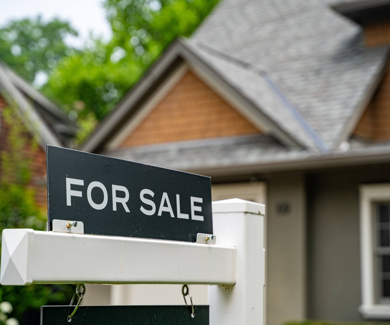 Home listed with a for sale sign signifies how the capital gains tax works.