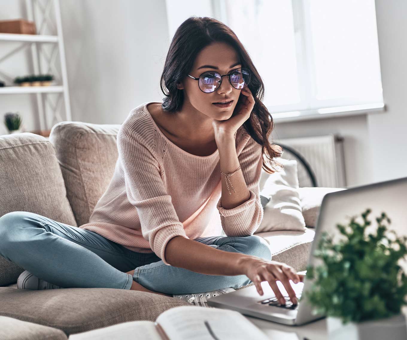 Woman researching when you can refinance a mortgage on a computer.