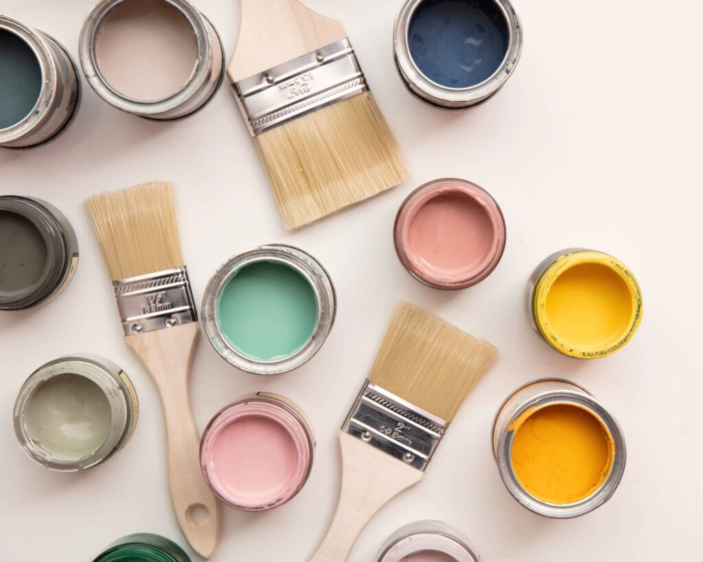 Selection of a homeowners paint cans and paint brushes used to update home.