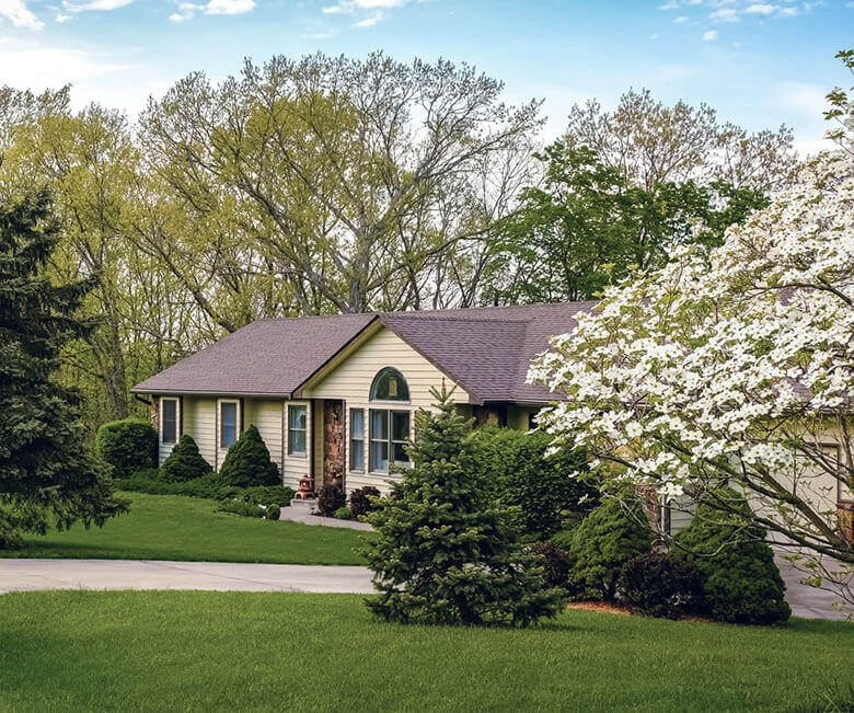 Exterior of a ranch style home whose mortgage is going through a refinance.