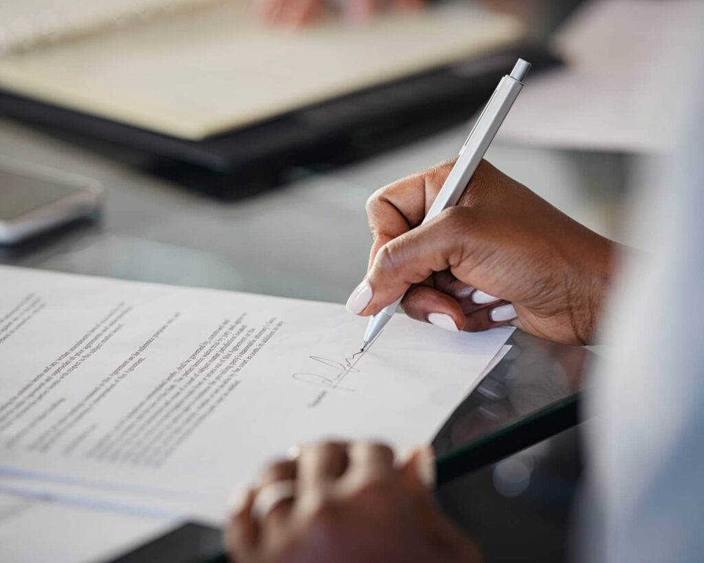 Signing a mortgage application.