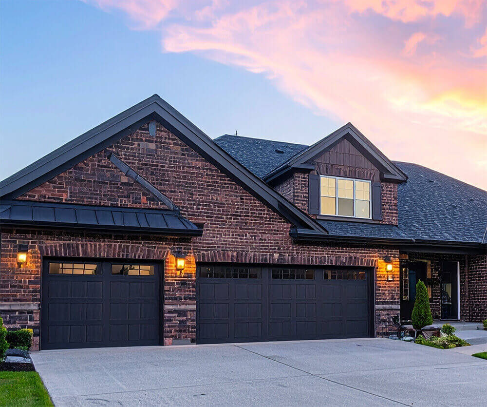Red brick modern farmhouse with wraparound porch and gabled roof showcasing a timeless home style.