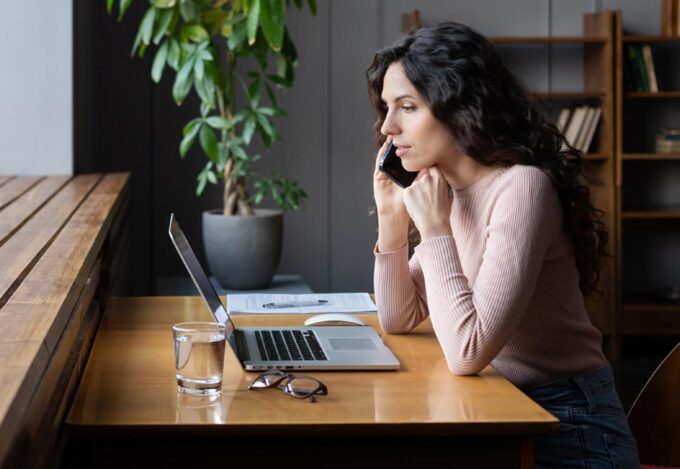 Woman on the phone looking into 2-1 buydown options